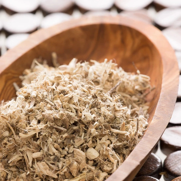 Wooden bowl filled with dried plant material